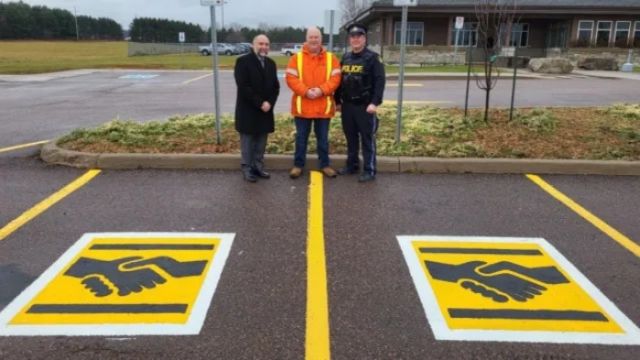 Here’s what a handshake symbol on a parking space means